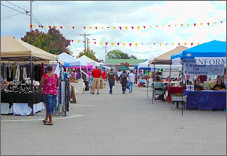 Oktoberfest visitors shopping participating vendors 